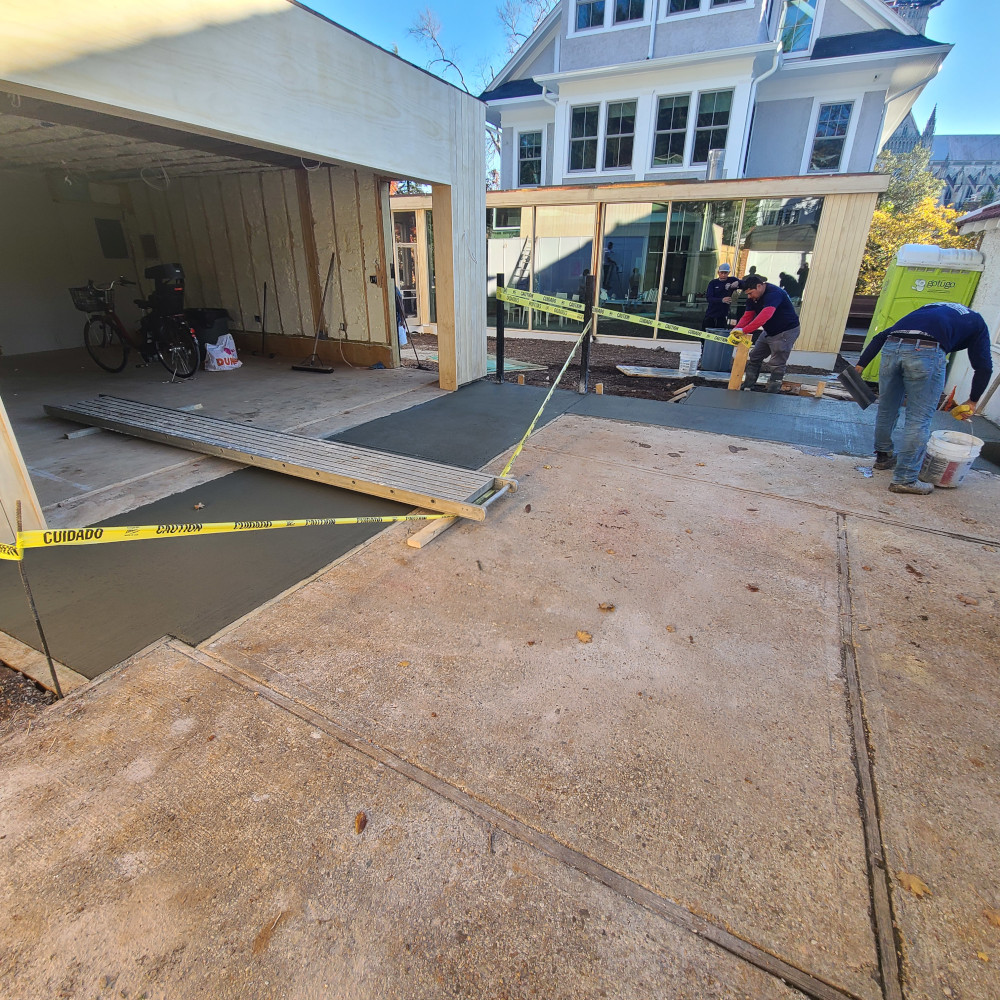 Construction workers building a garage