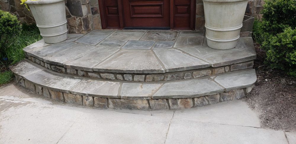 Front door steps built with stone slabs