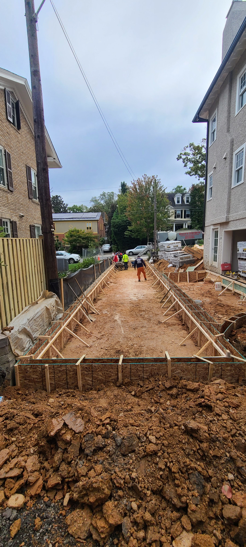 Construction workers setting the foundation
