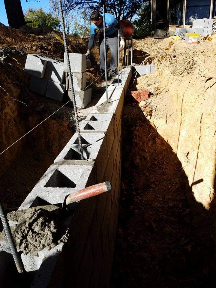 Laying concrete bricks