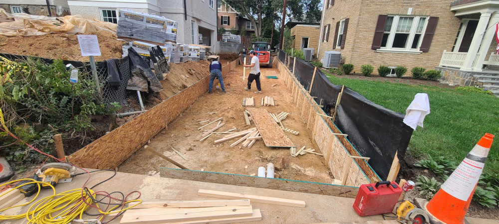 Workers constructing driveway